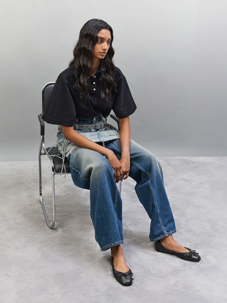 Sleek black ballet flats, an excellent footwear choice for barrel jeans.