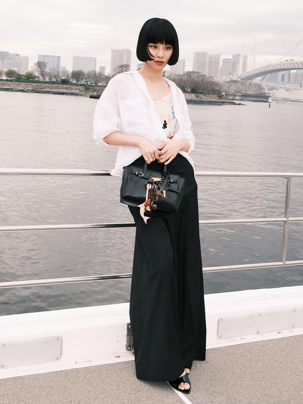 Women’s Delfina belted tote bag and Delfina dolphin & starfish charm, as seen on Ruka Xing - CHARLES & KEITH