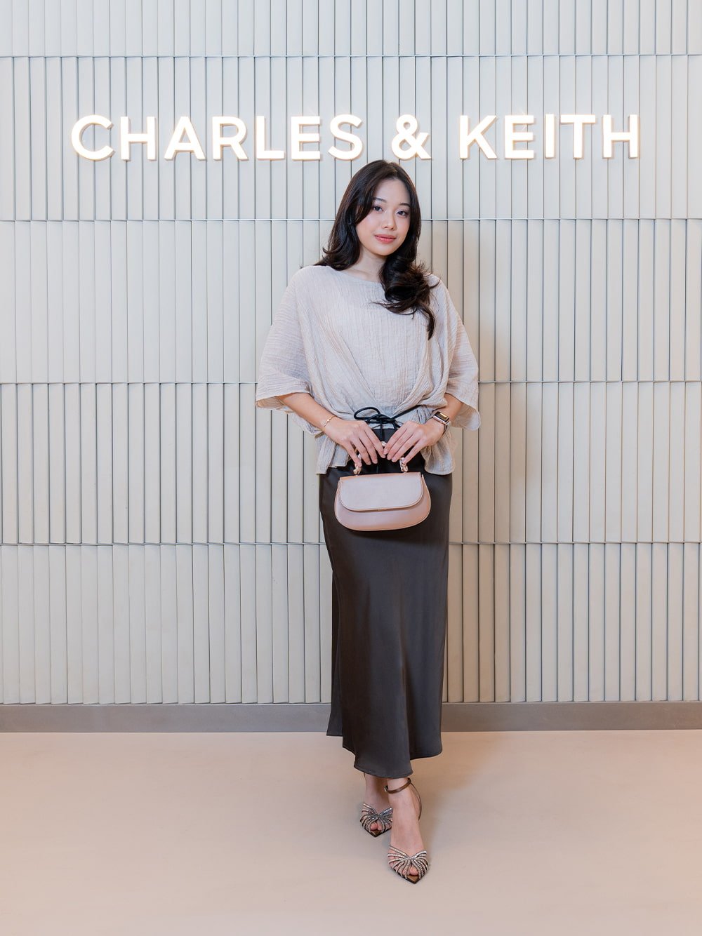 Eilian Satin Braided Top Handle Bag in champagne; Jaylene Gem Peep-Toe Stilet¬to Sandals in black textured - CHARLES & KEITH