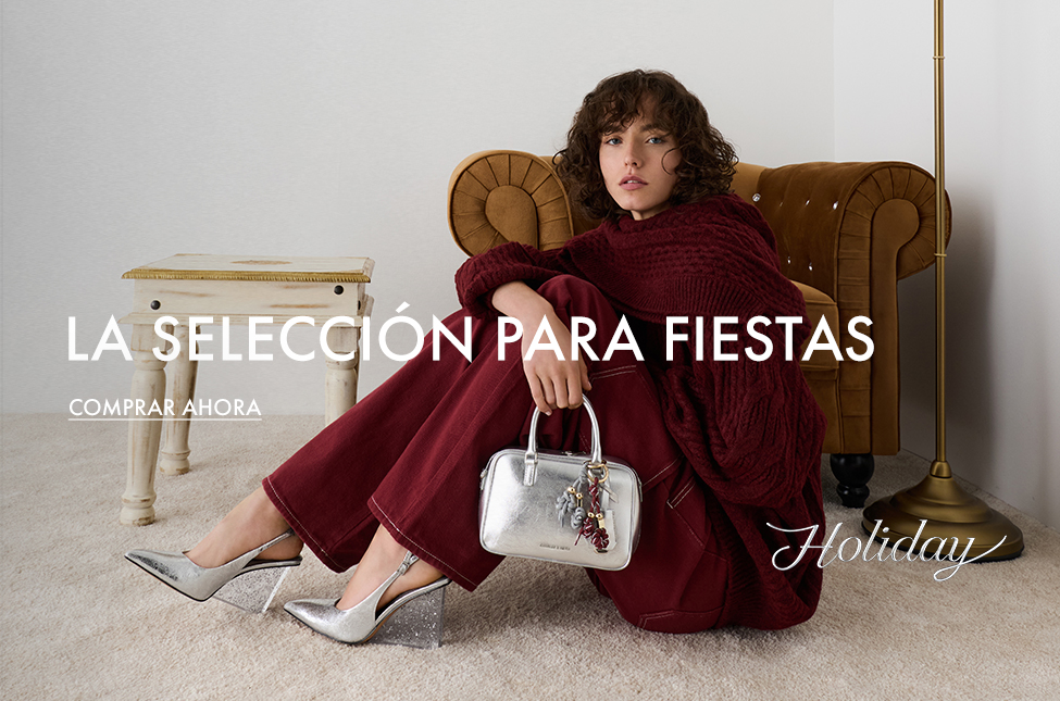 Mules de cuña plateadas metalizadas con tacón moteado y efecto arrugado
Cuñas destalonadas con tira posterior metalizadas plateadas con tacón moteado y efecto arrugado