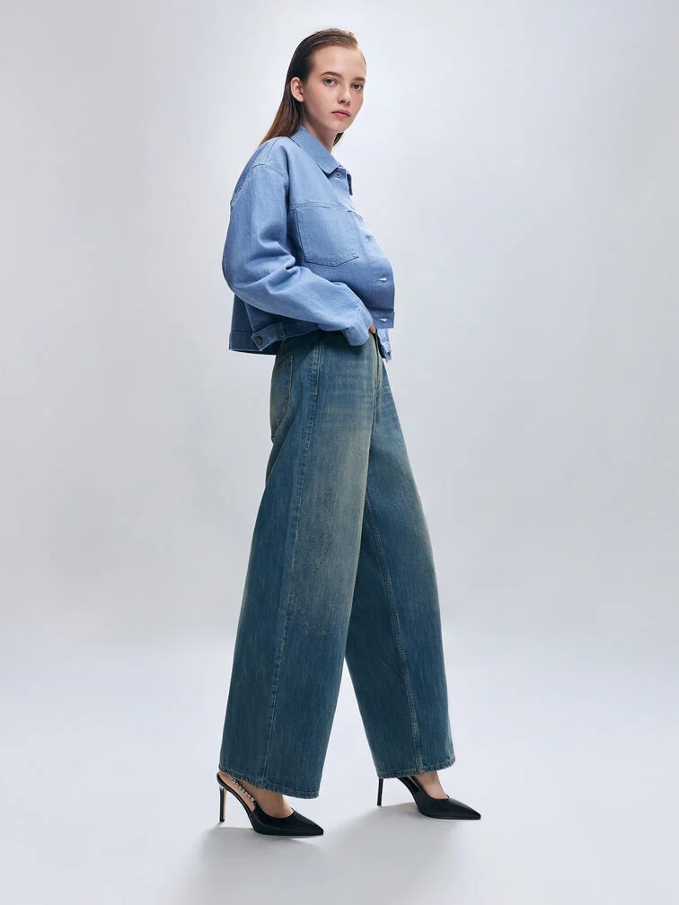 Straight-leg jeans paired with pointed-toe slingback pumps for a sleek, leg-lengthening look.