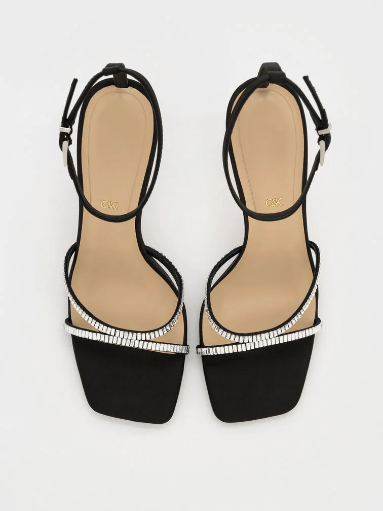  Black stiletto sandals with gem-embellished straps are the perfect party shoes.