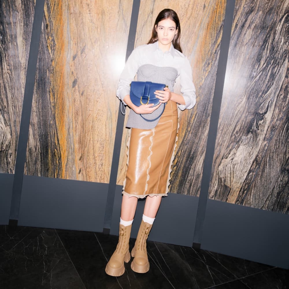 Women's navy Gabine saddle bag and brown Mardela front zip ankle boots - CHARLES & KEITH