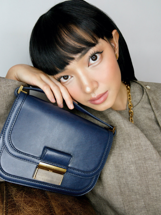 Women’s Charlot crossbody bag in navy, as seen on Chau Bui - CHARLES & KEITH