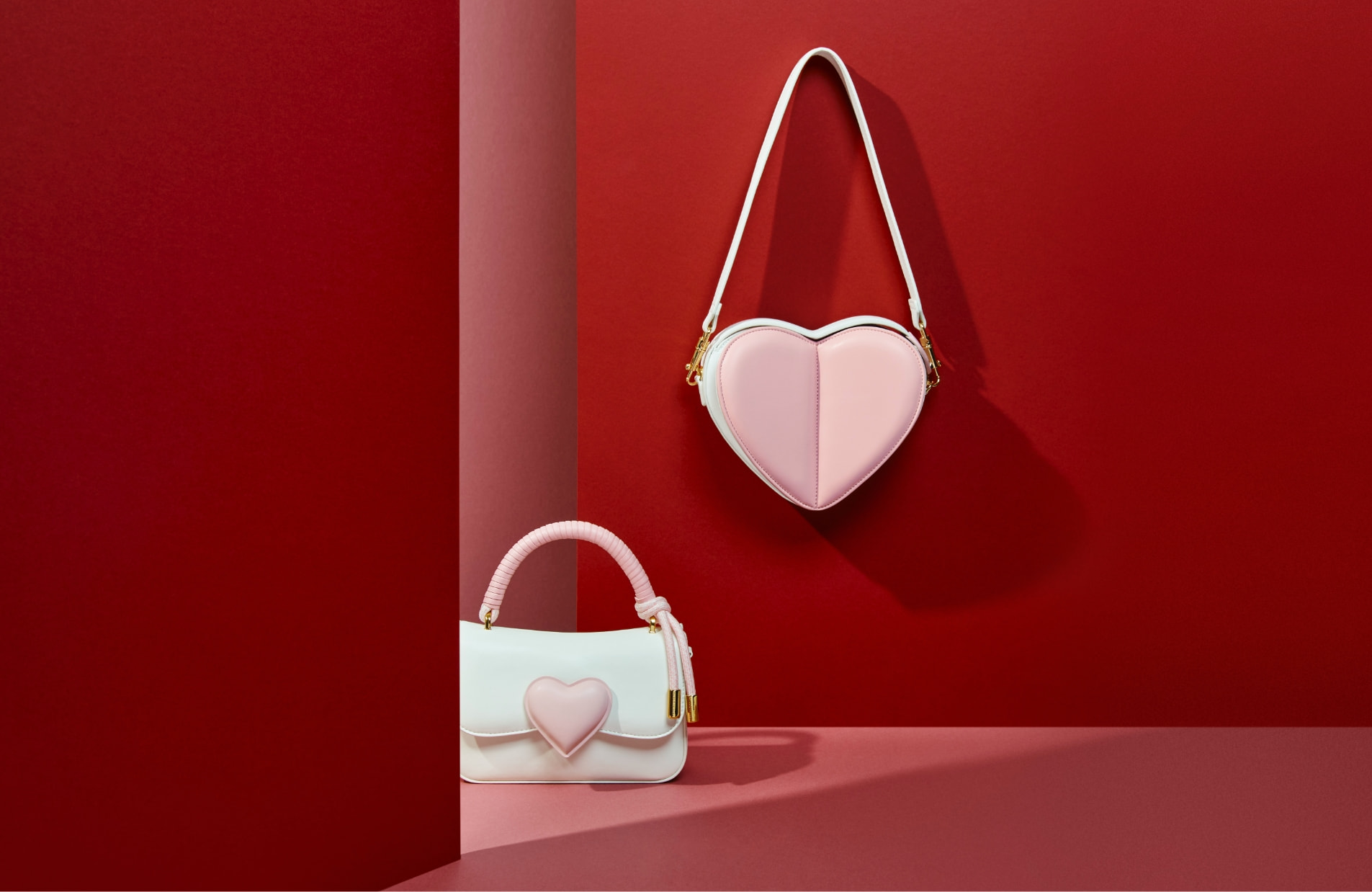 Women’s heart sling bag and heart motif coiled top handle bag in white - CHARLES & KEITH