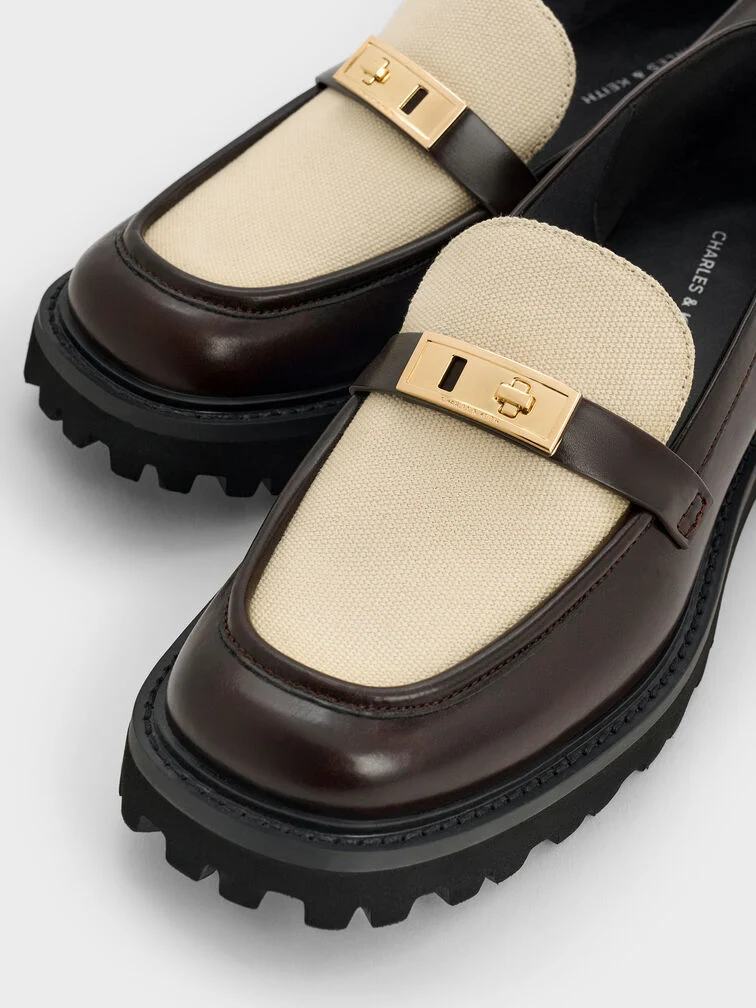 Lug-sole loafers are identifiable by their rubber soles with ridged indentations.