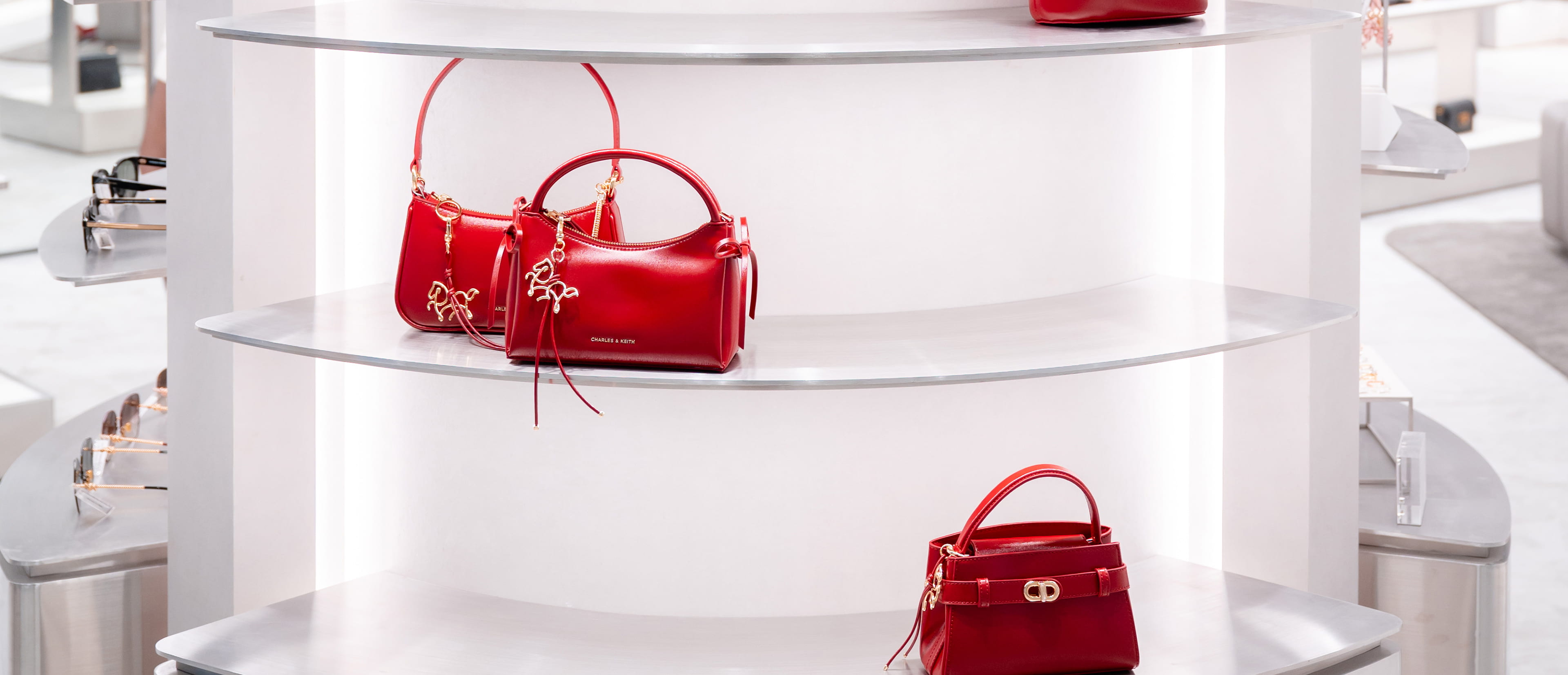 Women’s Hazel bow horse-motif top handle bag and Aubrielle horse-motif top handle bag - CHARLES & KEITH