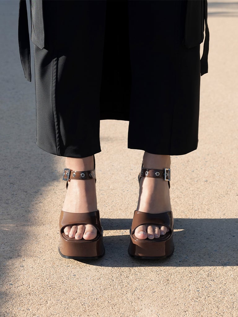 Women’s Jocelyn grommet ankle-strap platform sandals in brown (close up) - CHARLES & KEITH