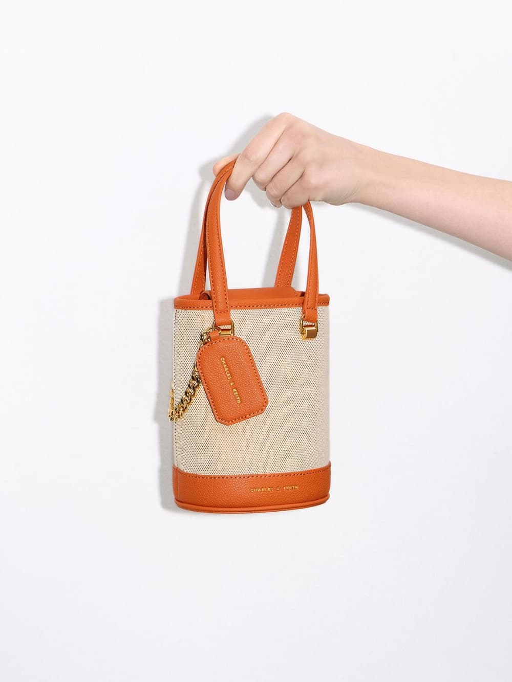 Women's orange Avis cylindrical bucket bag - CHARLES & KEITH