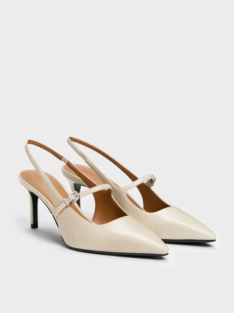 Slingback Mary Jane pumps with pointed toes and stiletto heels, a classic with a modern twist.