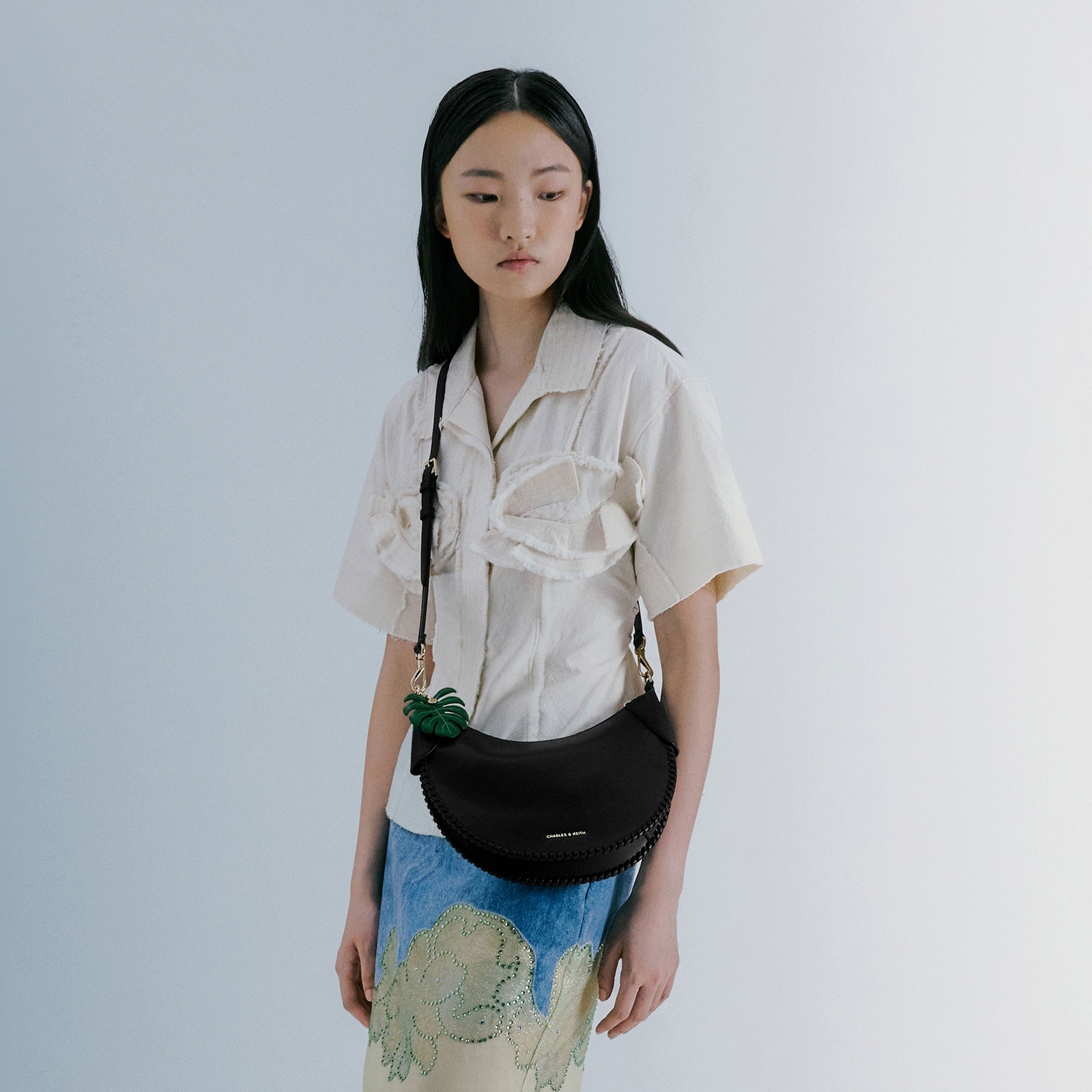 Blume Braided Curved Hobo Bag in Black. Cream and Matcha Green - CHARLES & KEITH