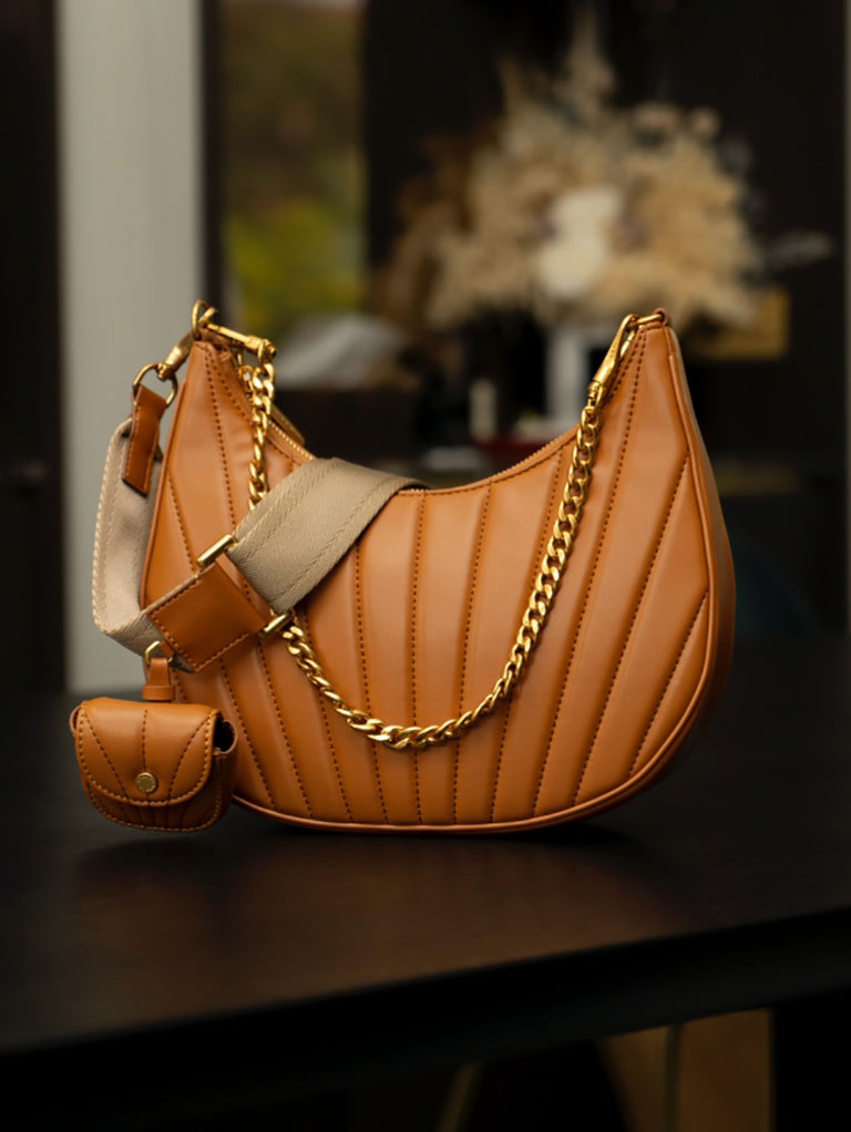 women’s chain handle pleated moon bag in tan – CHARLES & KEITH
