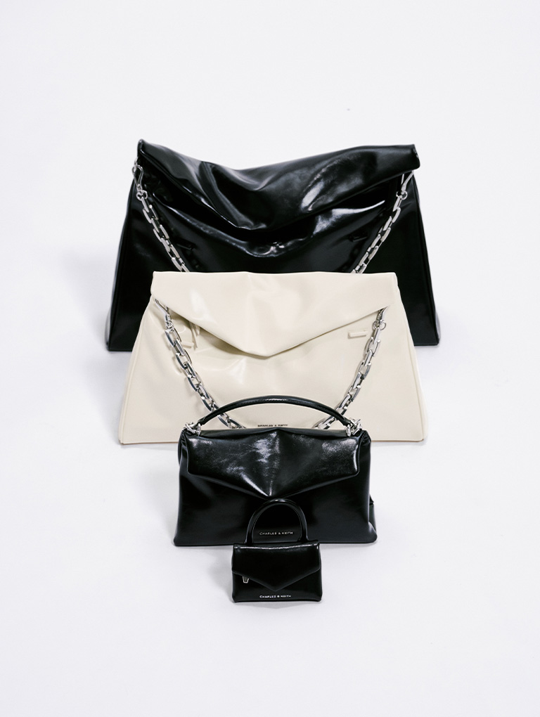 Featuring the Andromeda bags in 4 different sizes, XL, L, S and a micro-sized XS charm - CHARLES & KEITH