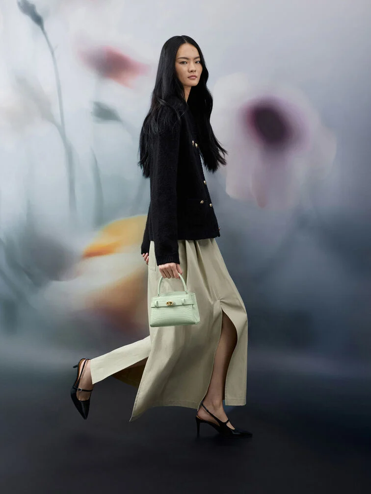 Pointed-toe Mary Jane slingback pumps perfectly complement an office-ready bouclé jacket and long skirt ensemble.