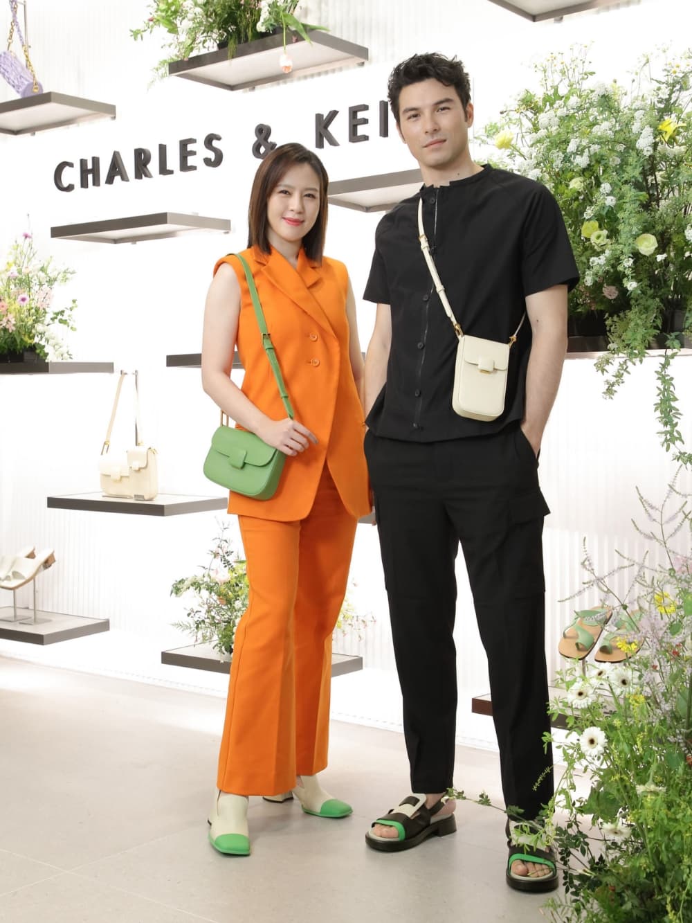 Liu Pin Yan sports our chalk Andre leather penny loafer pumps and green Koa square push-lock shoulder bag; Feng Xiao Yue sports our beige Koa elongated wristlet bag and Blake multicoloured leather slingback heeled sandals - CHARLES & KEITH