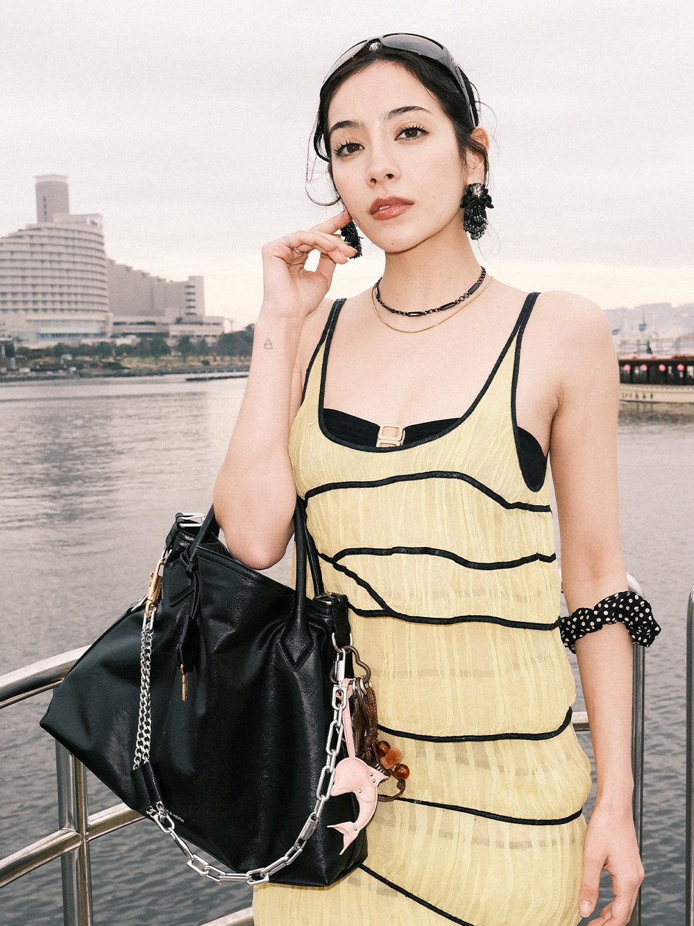 Women’s Delfina chain tote bag and Delfina dolphin & starfish charm, as seen on Momoe - CHARLES & KEITH