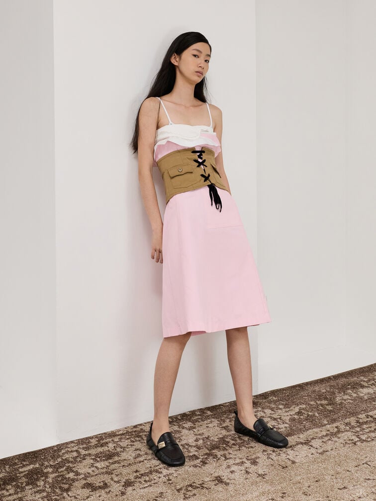 Black horsebit loafers styled with a midi dress for a date-night look. 