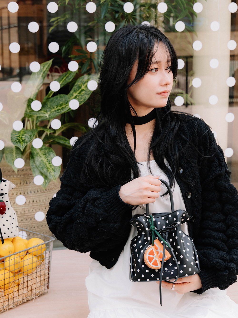Hazel Bow Polka-Dot Bucket Bag in noir and orange slice charm - CHARLES & KEITH