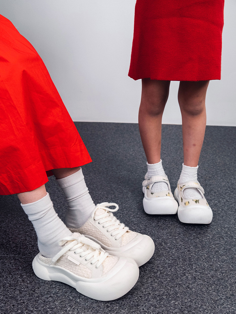 Women’s satin lace-up slip-on sneakers and girls’ floral print Mary Jane sneakers, as seen on Michelle Kong and her daughter 