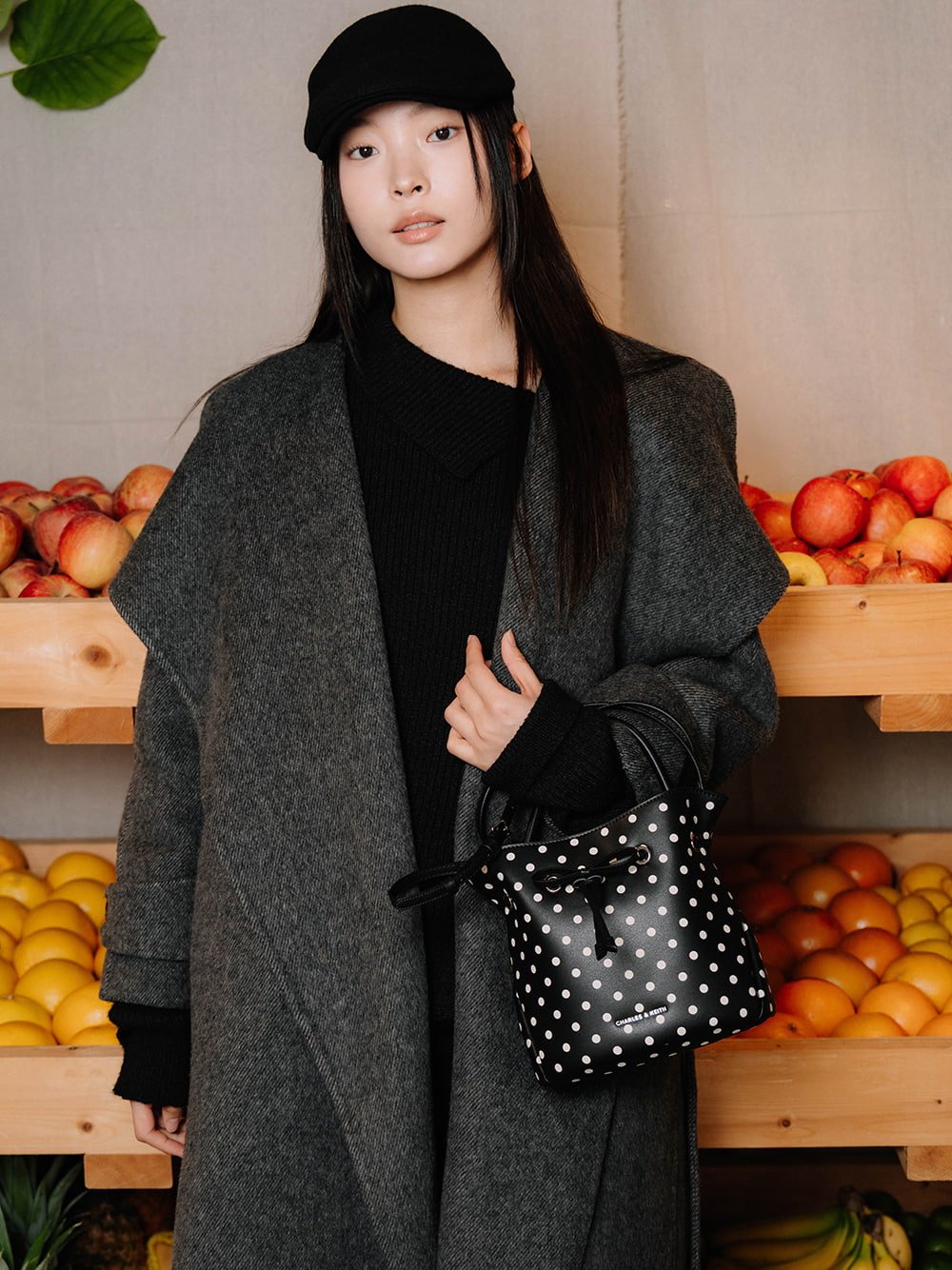 Hazel bow polka-dot top handle bag in noir - CHARLES & KEITH