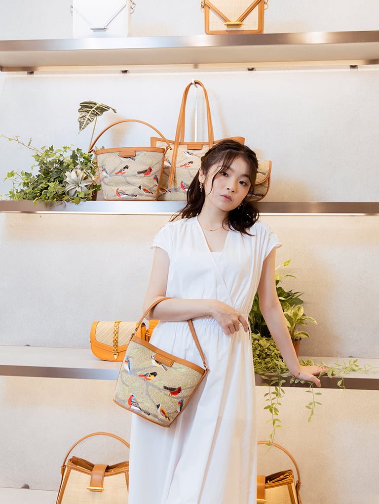 Hong Kong personality Isabella Chang poses with our Flora jacquard bucket bag   - CHARLES & KEITH