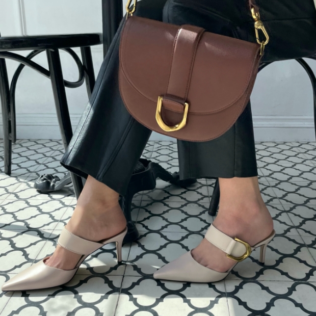 CHARLES & KEITH - As seen on Kat Collings. Shop now: Gabine saddle bag -   Gabine buckled leather mule pumps 