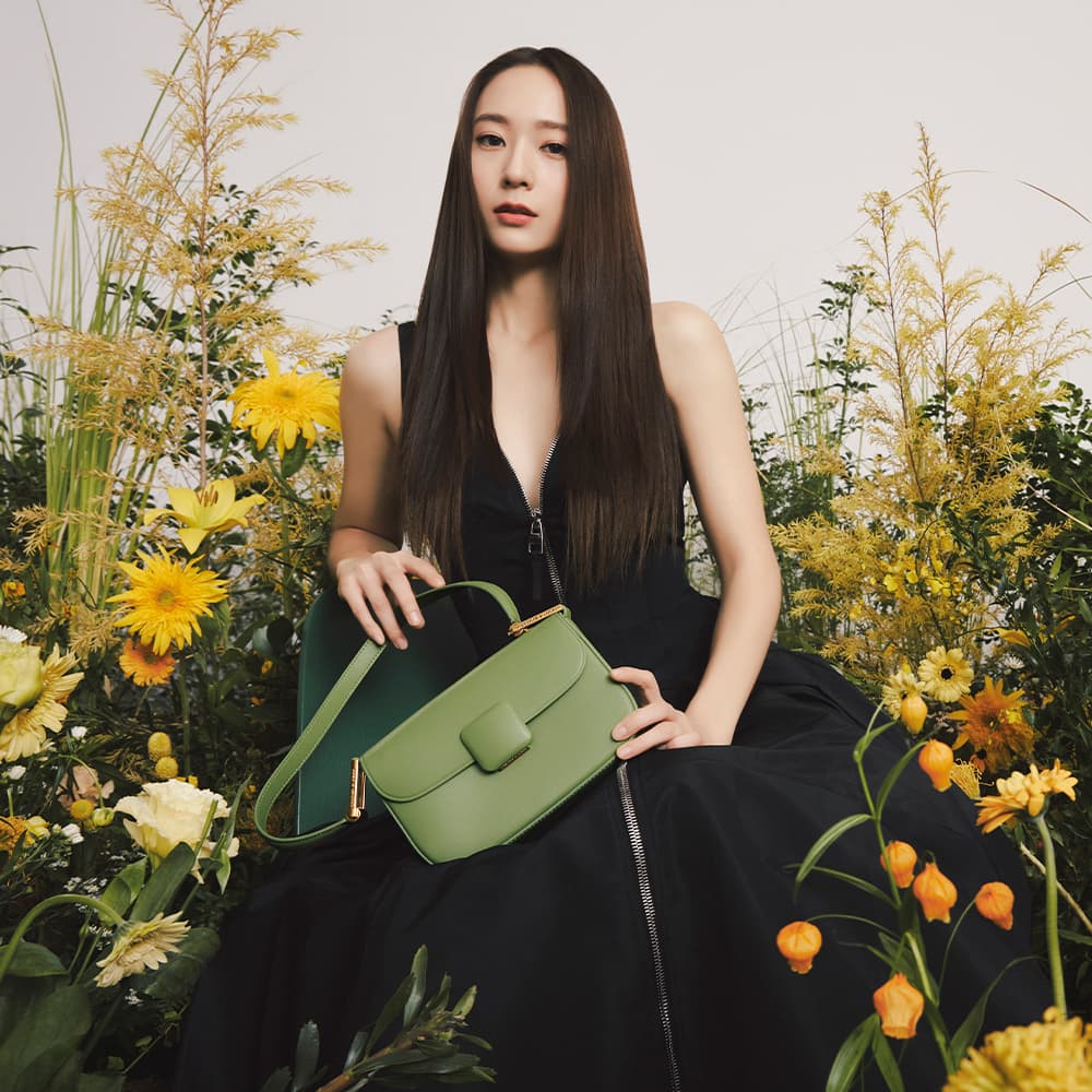 Global brand ambassador Krystal Jung sports our green Koa square push-lock shoulder bag - CHARLES & KEITH