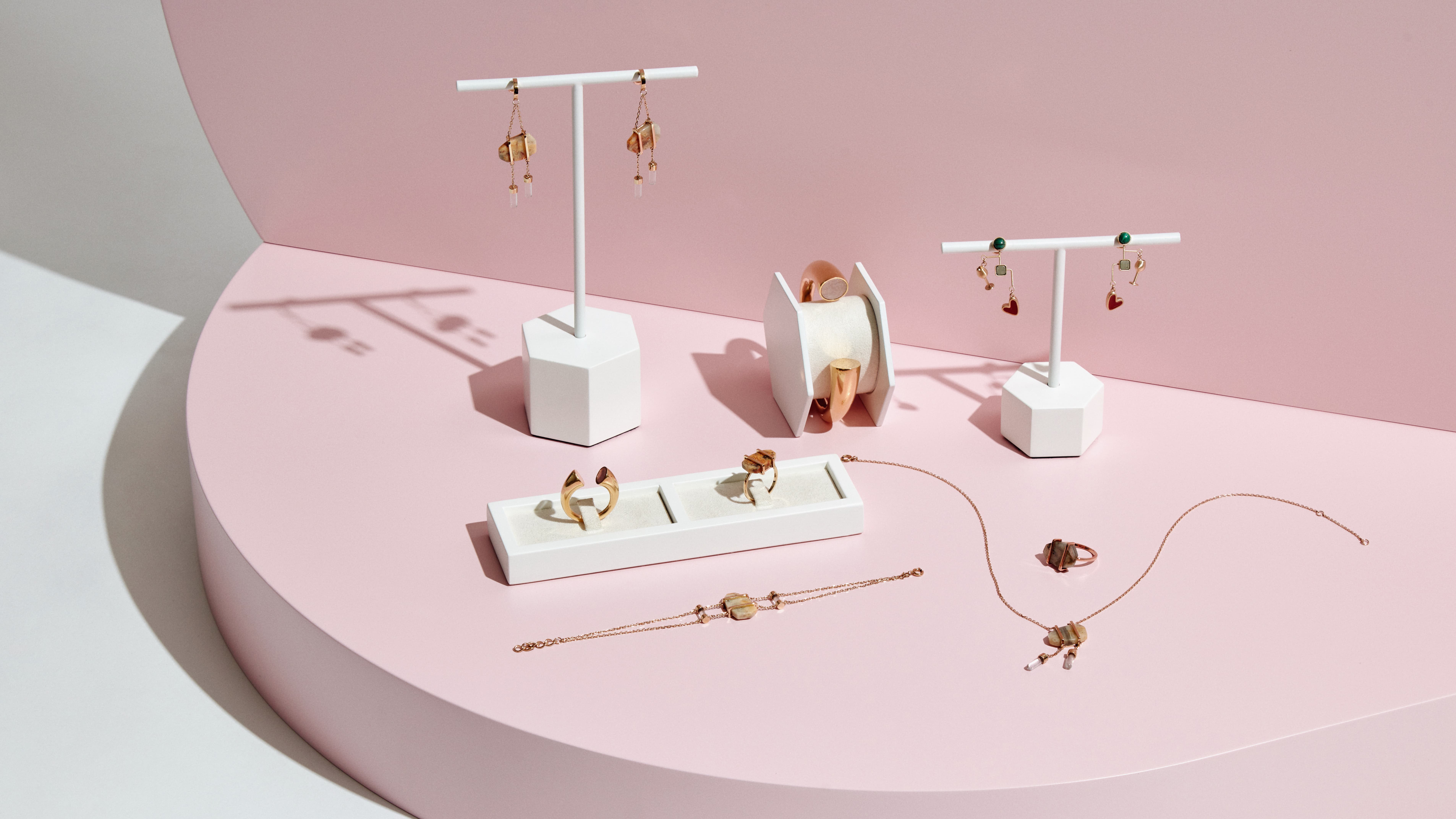 A jewellery spread of semi-precious stone rings, earrings, necklaces and bracelets