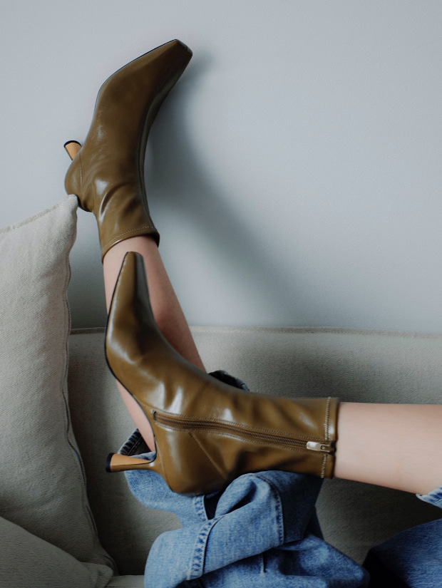 Women’s Zadie padded shoulder bag in black and sculptural ankle boots in olive, as seen on Cheri Nara - CHARLES & KEITH