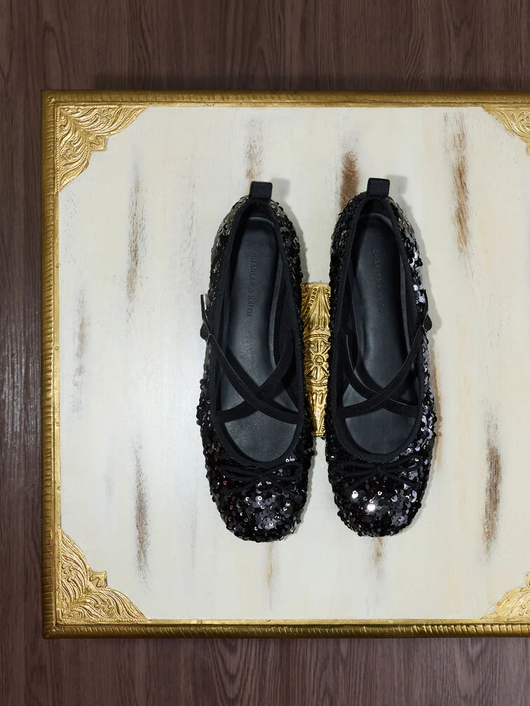 Black sequinned Mary Jane flats, a versatile complement to cocktail dresses.  