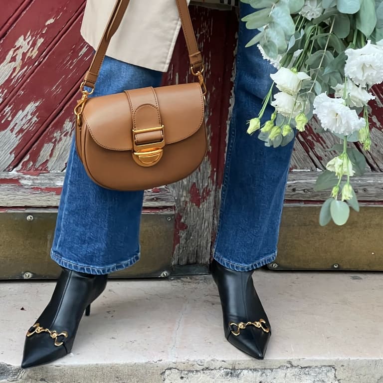 Women’s Amelia metallic push-lock crossbody bag and Elery slip-on ankle boots, as seen on Zoia Mossour - CHARLES & KEITH