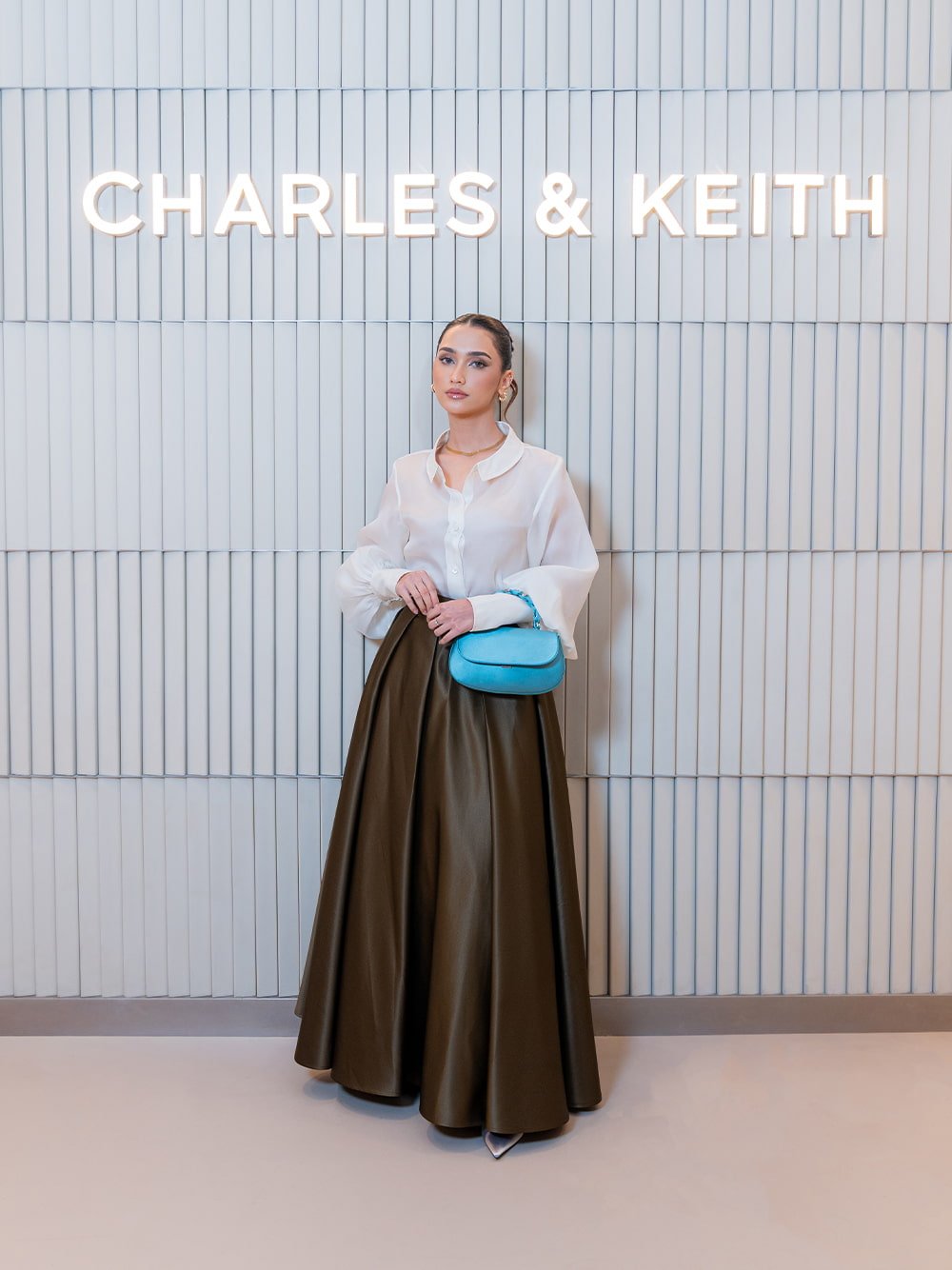 Eilian Satin Braided Top Handle Bag in teal; Teardrop-Crystal Buckle-Strap Mules in silver - CHARLES & KEITH