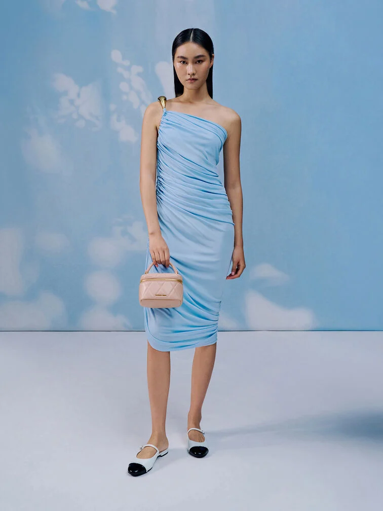Sky blue dress styled with a pink top-handle bag.  