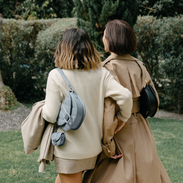 Mini Gabine quilted saddle bag and micro Gabine quilted saddle bag, both in steel blue, Gabine buckled leather ankle boots in black - CHARLES & KEITH