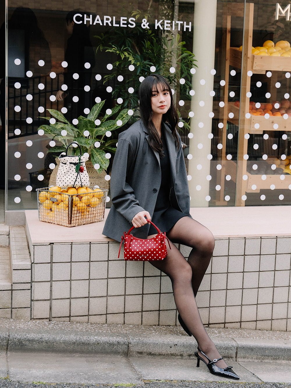 Hazel Bow Polka-Dot Top Handle Bag in equestrian red and Sonali bow slingback pumps in black - CHARLES & KEITH