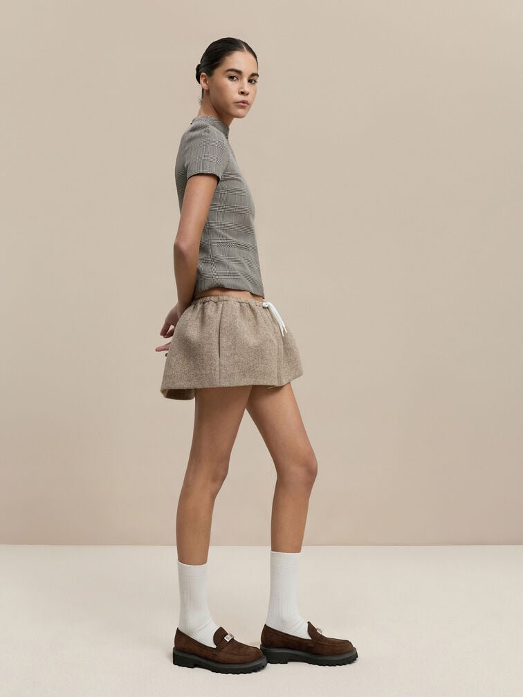  Loafers add instant polish to a casual top and miniskirt ensemble.