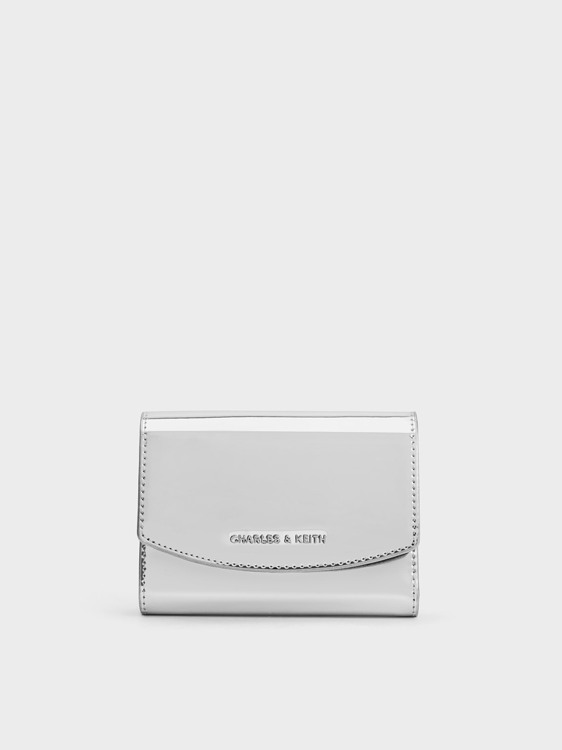 Shop Charles & Keith Metallic Curved Front Flap Wallet In Silver