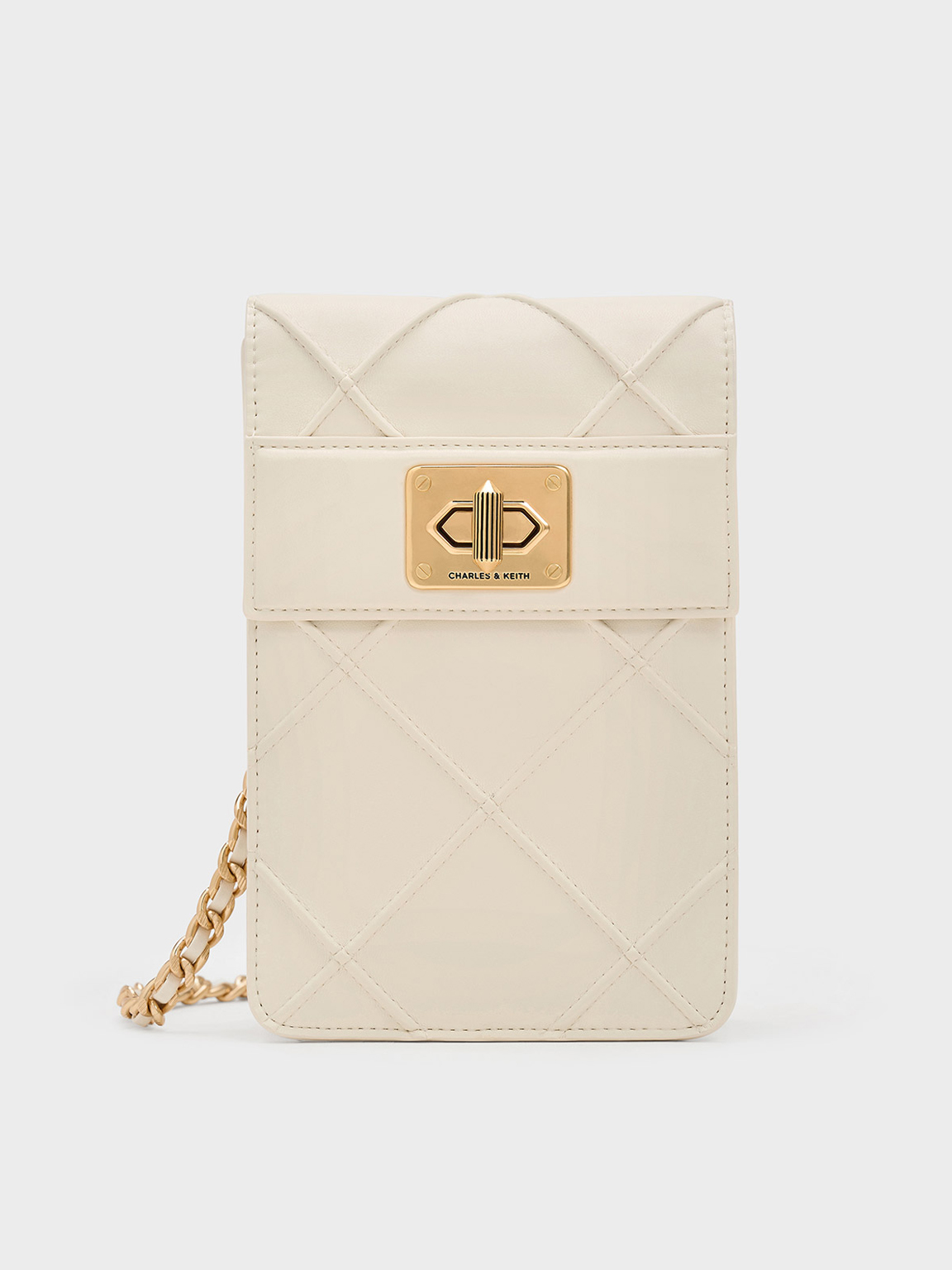 Shop Charles & Keith - Eleni Quilted Elongated Crossbody Bag In Cream