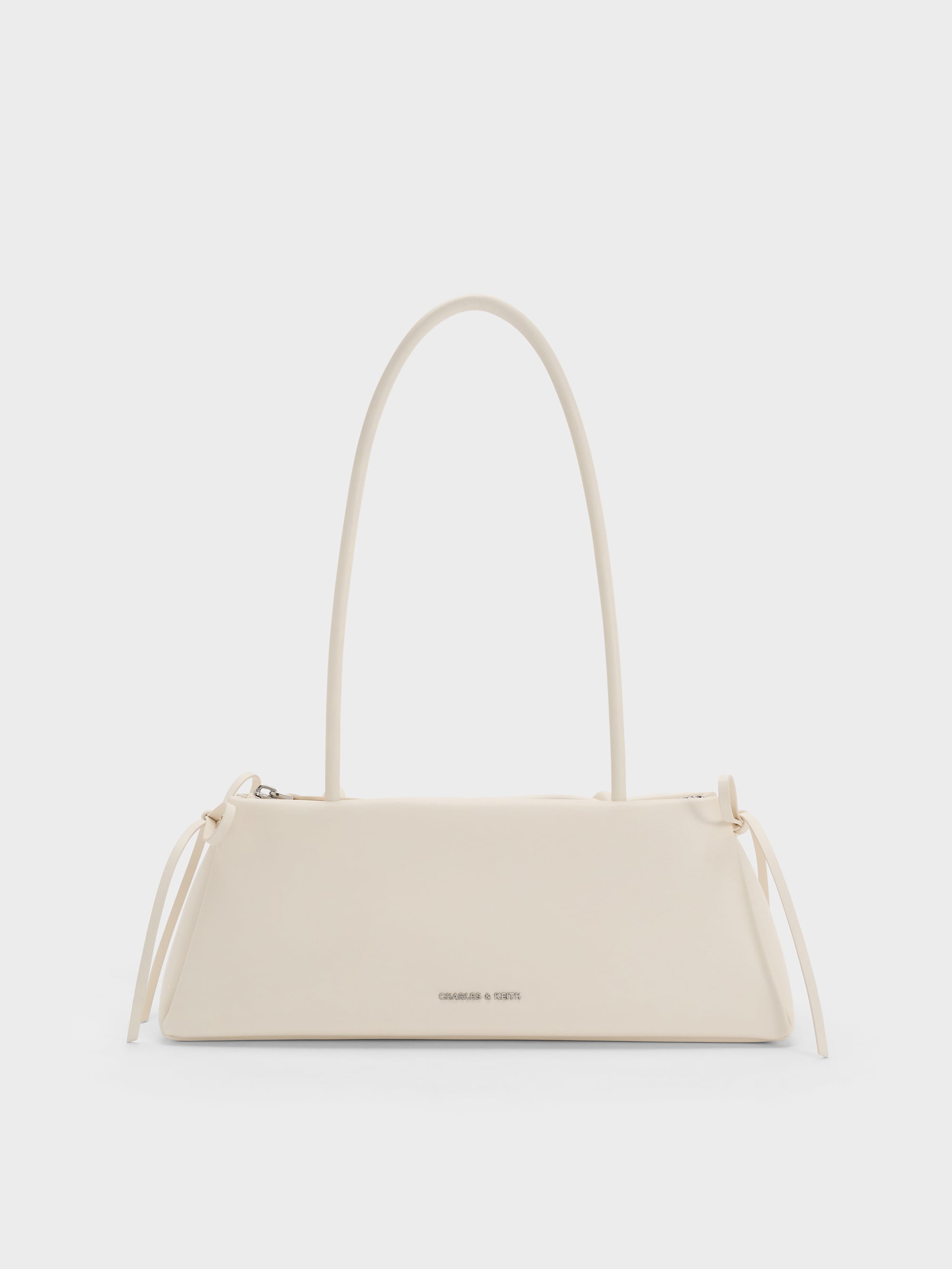 Hazel Bow Elongated Shoulder Bag - Cream - CHARLES & KEITH KR