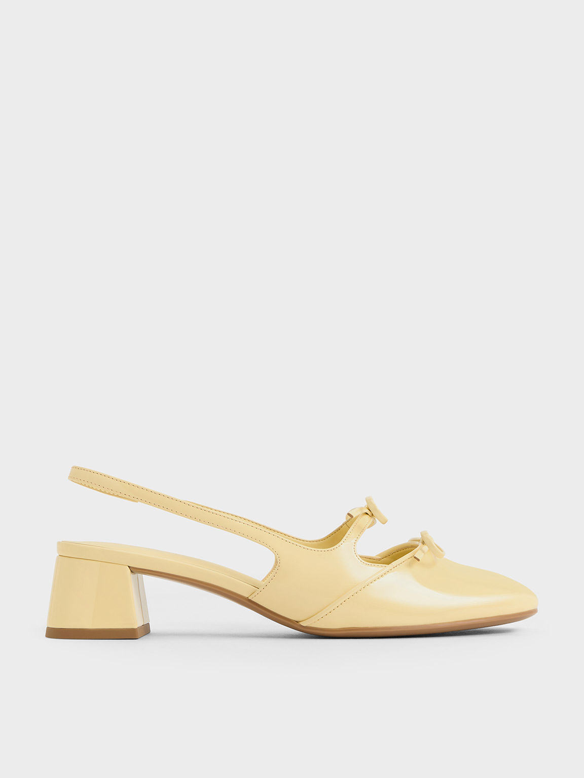 Charles & Keith Dorri Double-bow Slingback Pumps In Butter