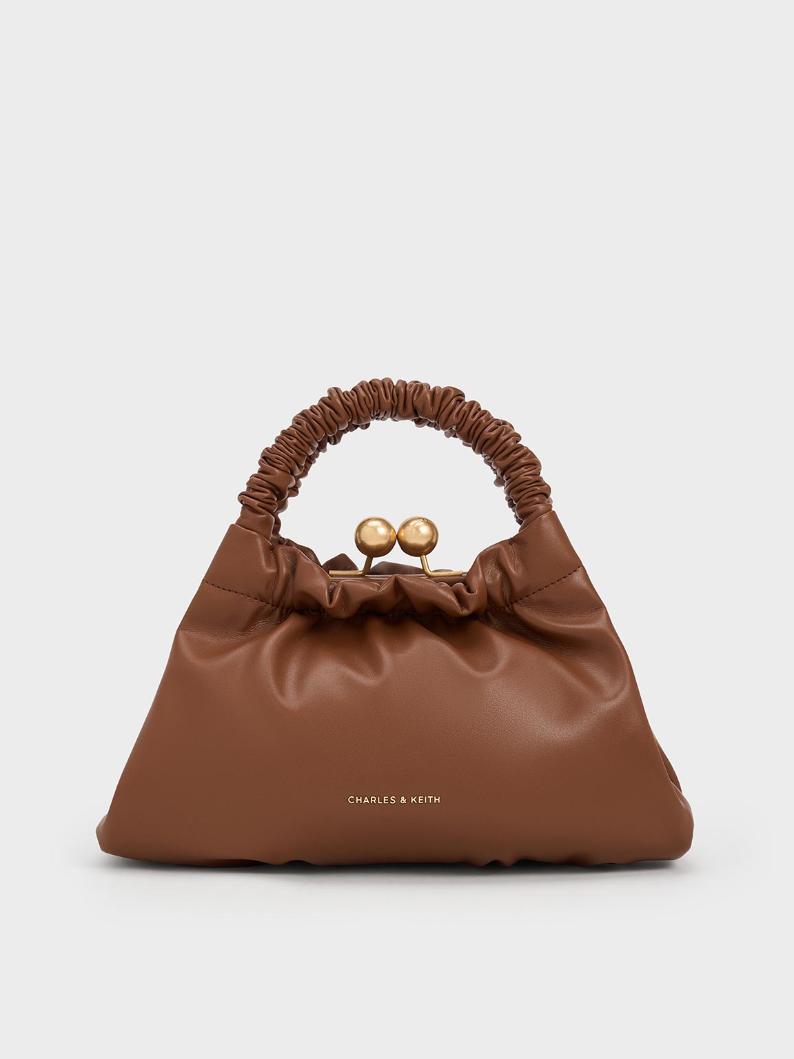 Shop Charles & Keith - Eve Ruched-handle Trapeze Bag In Chocolate