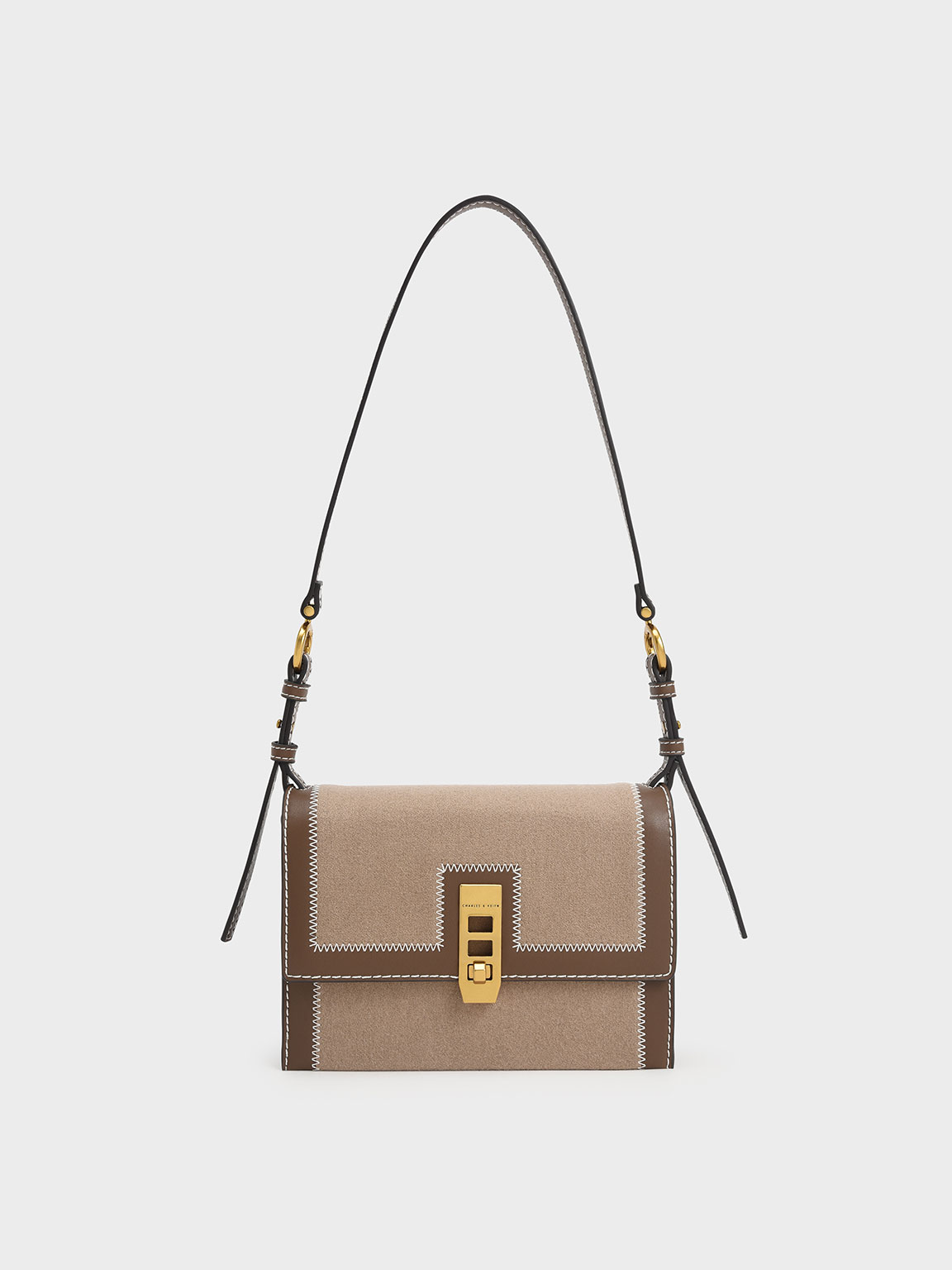 charles and keith turn lock crossbody bolsa