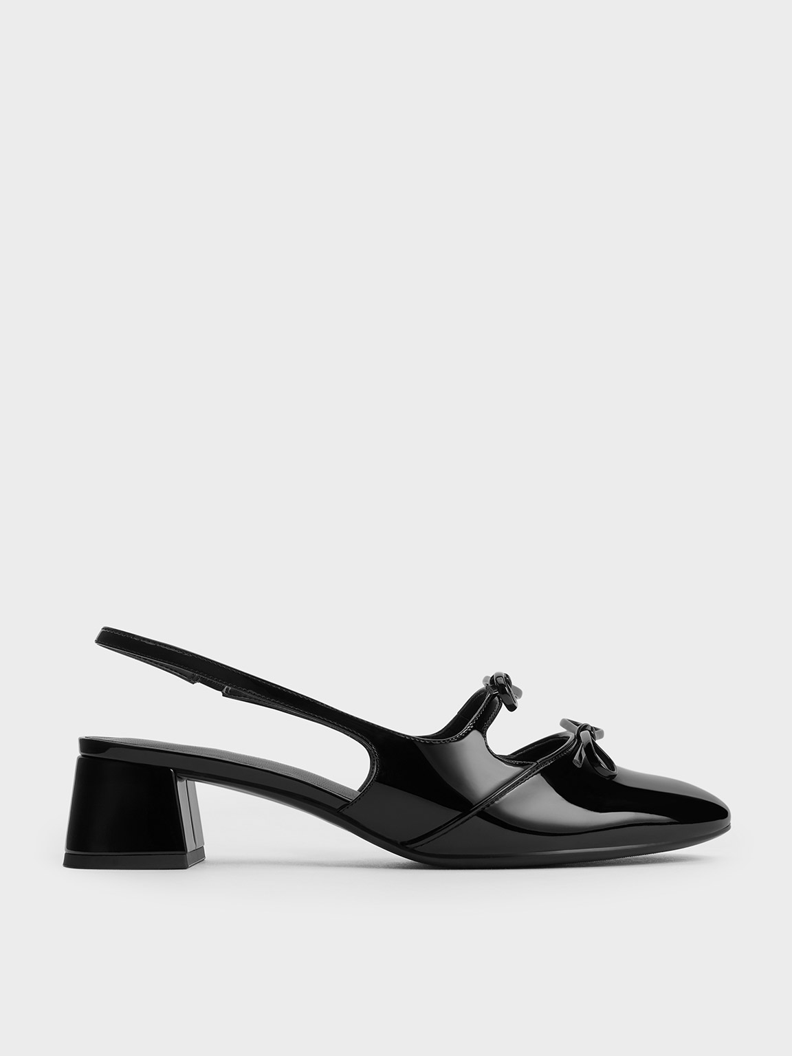 Charles & Keith Dorri Double-bow Slingback Pumps In Black Patent